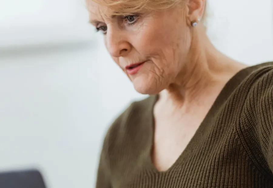 Adult working with a computer in an everyday setting