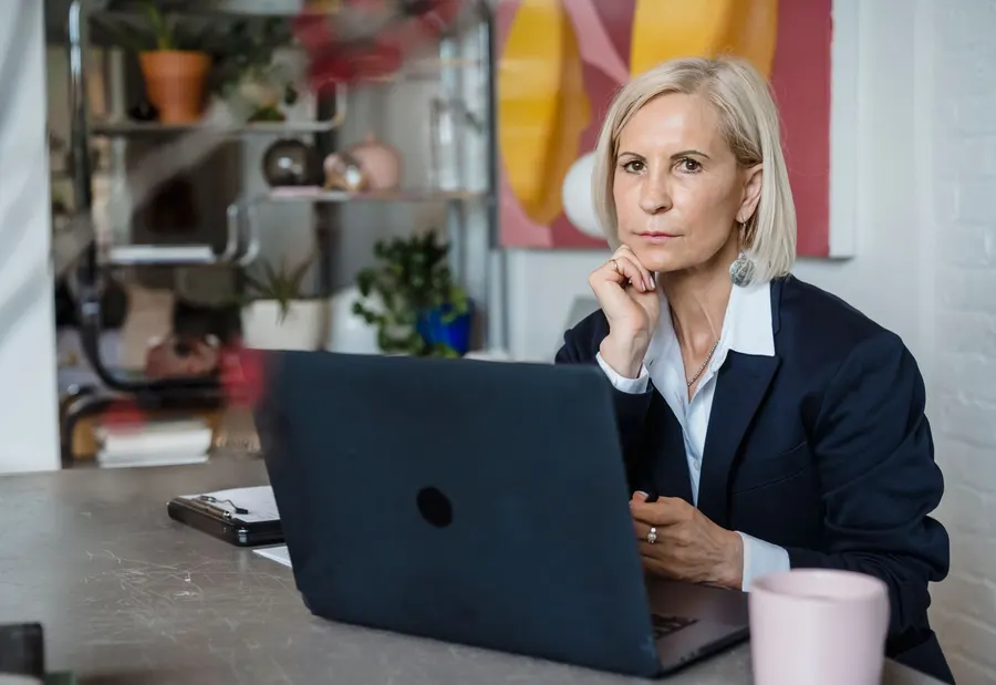 Adult working with a computer in an everyday setting